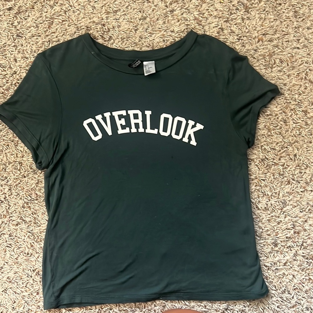 Dark green very stretchy t shirt. Size small